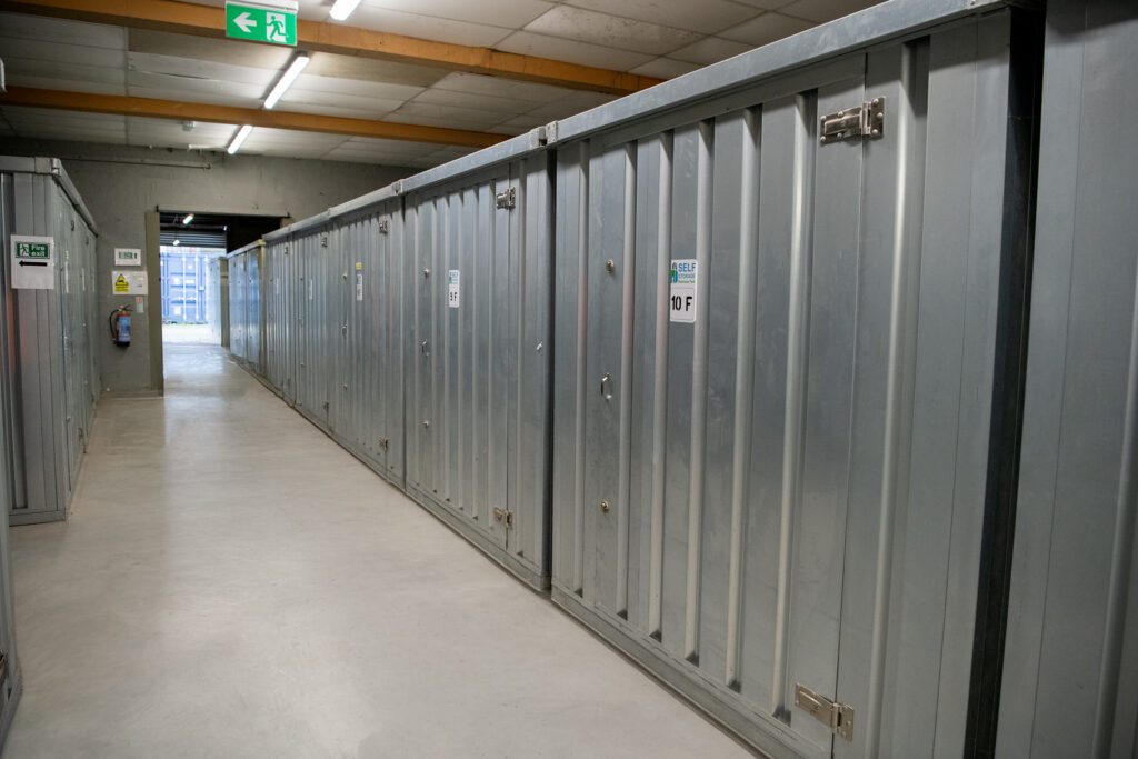 Indoor self storage units along a lit corridor