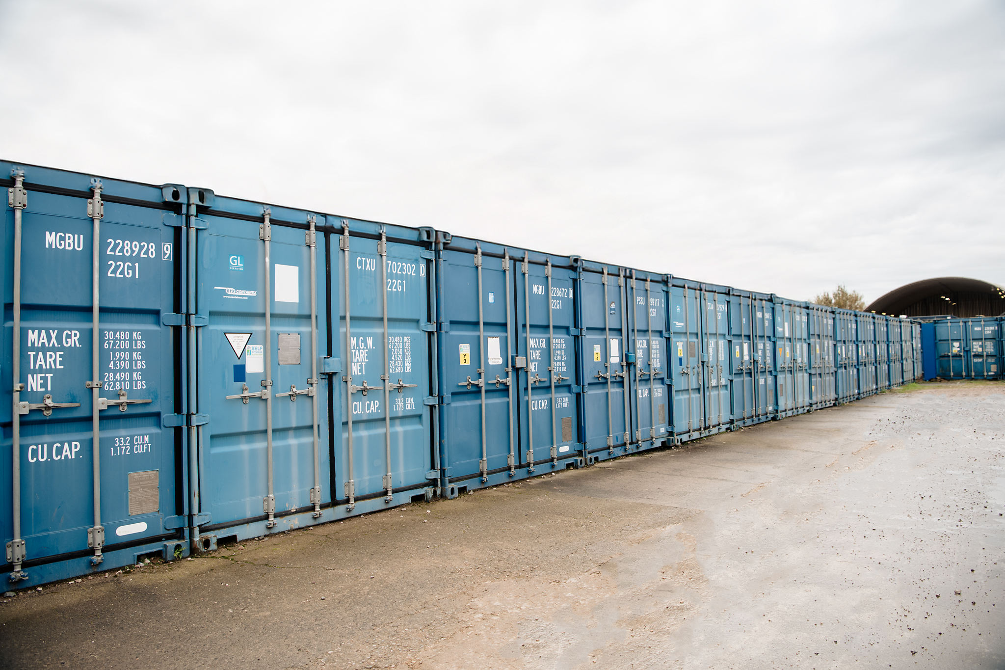 Long row of blue container storage units at Store For You