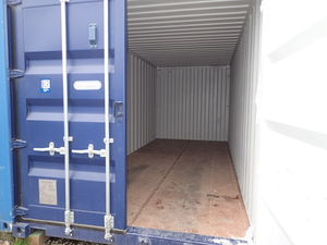 Open blue shipping container storage unit